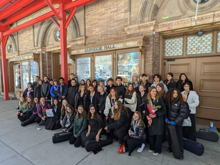 Malibu High School Orchestra in front of Carnegie Hall in New York City.