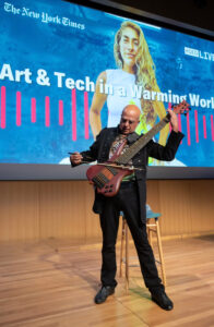 Eduardo Del Signore performing solo six-string bass with a cello bow at Art and Tech in a Warming World.